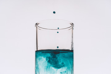 Colored liquid droplets in a test tube