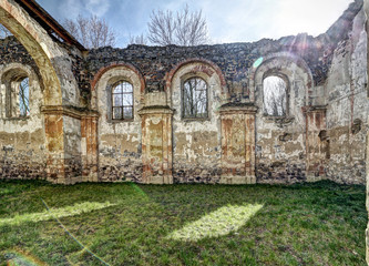Fototapeta na wymiar Interior of the main church aisle without roofing and grassy floor