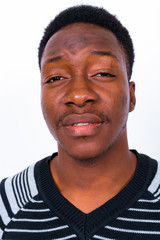 Obraz premium Young handsome African man against white background