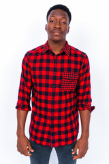 Fototapeta premium Young handsome African man against white background