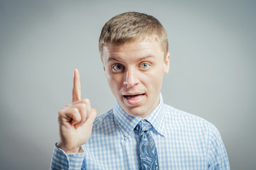 Eureka. man with an idea raising his finger in the air