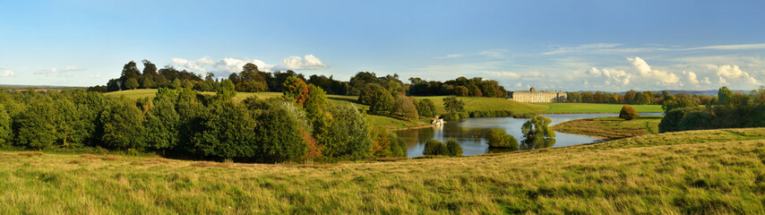 Petworth Park House in Landscape created by Capability Brown at the end of the day, sunset, England, Great Britain. Panorama