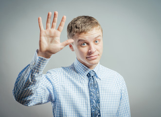 young man waving, smiling
