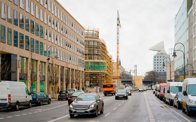Street with cars and building construction in road in Berlin reflex