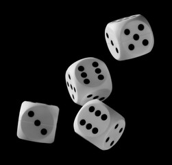 White playing, gambling die, dice for tabletop games and poker isolated on black background with clipping path