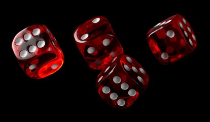 Red playing, gambling die, dice for tabletop games and poker isolated on black background with clipping path