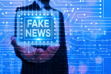 Conceptual hand writing showing Fake News. Concept meaning false information publish under the...