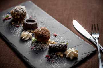 Homemade chocolate candies with almond cookie crumbs