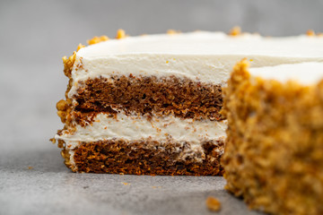 nut cake with cream on a gray background