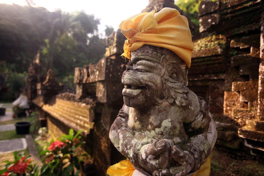 Yellow Headscarf On Demon Statue At Park