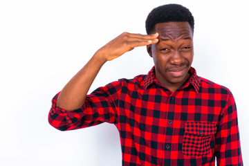Fototapeta premium Young handsome African man against white background