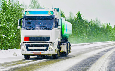 Fototapeta na wymiar Tanker storage on road at winter Rovaniemi reflex