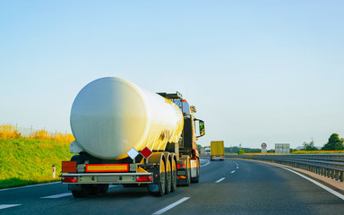 White Tanker storage truck at asphalt highway Poland reflex
