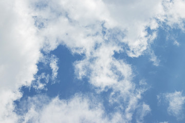 Blue sky white soft clouds background. Natural colors