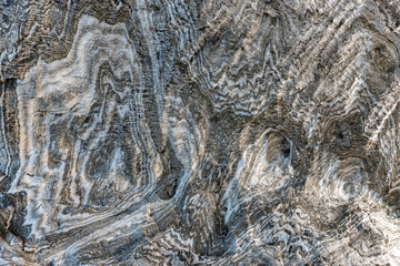 Abstract gray texture of natural, raw salt in an underground salt mine