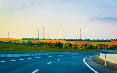 Scenic landscape with road in Slovenia wind mill reflex
