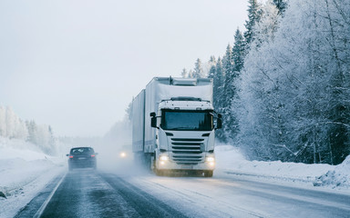 Truck at the Snowy winter Road Finland Lapland reflex