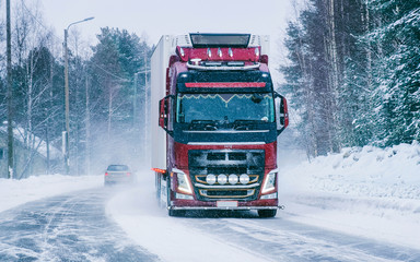 Truck on the Snowy winter Road at Finland in Lapland reflex