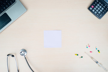 Copy space with stethoscope and laptop