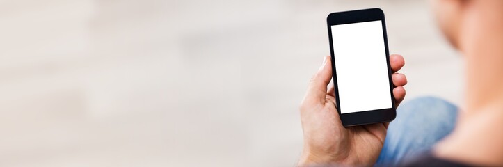 Man's Hand Holding Cell Phone With Blank Screen