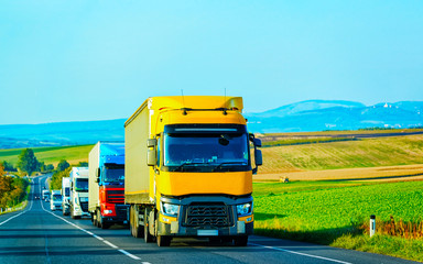 Fototapeta na wymiar Yellow Truck in asphalt road of Poland reflex