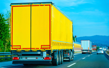 Yellow Truck on asphalt road of Poland reflex