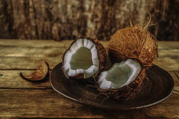 fresh coconuts on a rustic plate
