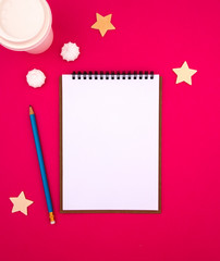 White notepad sheet on pink red background template