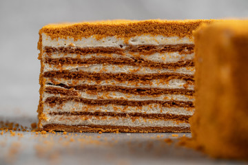 layer cake on a black background, homemade honey cake , dark background