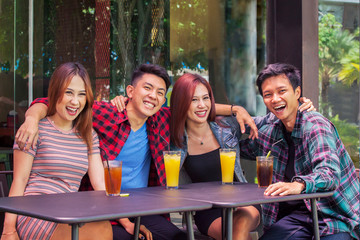 Group of young people smiling together at camera