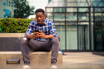 Young handsome African man exploring the city