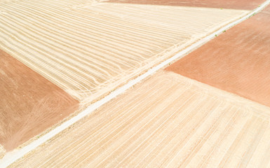 aerial view of a dirt road on a summer landscape next to Don Benito, province of Badajoz, Extremadura, Spain