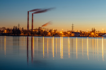Naklejka premium Evening industrial landscape reflecting in the river, Voronezh, Russia