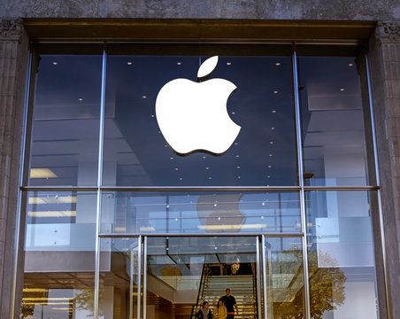 Hamburg, Germany: Logo of Apple Inc. on a Apple store. Apple is the multinational technology company headquartered in Cupertino, California and sells consumer electronics products.