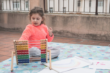little girl learning to count