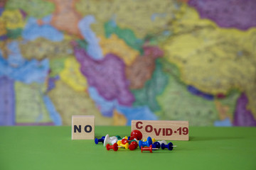 Stop the Covid-19 pandemic against the background of a geographic map.