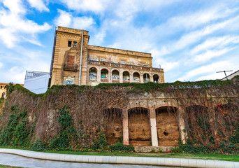 Abandoned building in a public park in the city of Barcelona surrounded by nature.