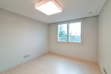 Interior of an empty small bedroom in a new apartment.  New apartment interior in South Korea.