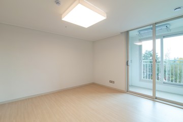 Interior of an empty master bedroom in a new apartment. 
New apartment interior in South Korea.