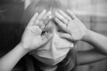 girl in a mask on self-isolation