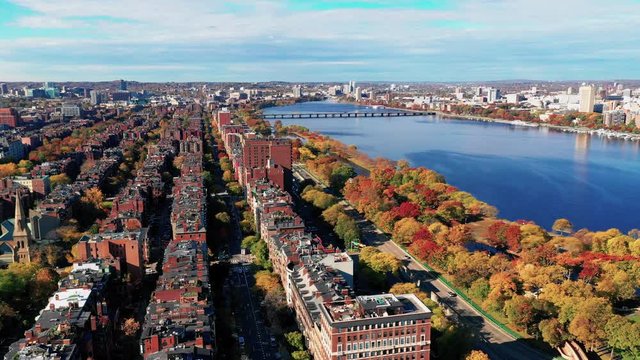 The Charles River is smooth on a sunny fall day in Boston MA Massachusetts
