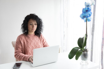 Woman works from home with the computer