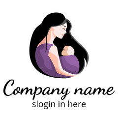 Slhouette of woman holding baby