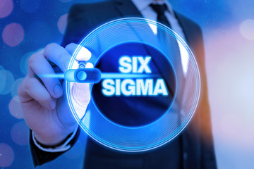 Writing note showing Six Sigma. Business concept for set of management techniques intended to...