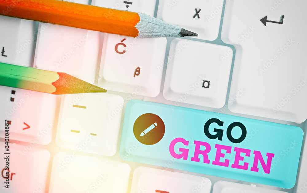 Poster writing note showing go green. business concept for making more environmentally friendly decisions a