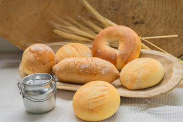 Baked breads on wooden table background.