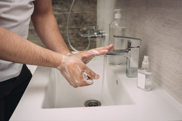 Washing hands rubbing with soap man for corona virus prevention, hygiene to stop spreading coronavirus.sanitiser, covid 19