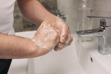 Washing hands rubbing with soap man for corona virus prevention, hygiene to stop spreading coronavirus.sanitiser, covid 19