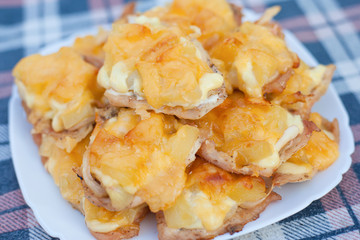 french chops dish of chicken meat pineapple and cheese