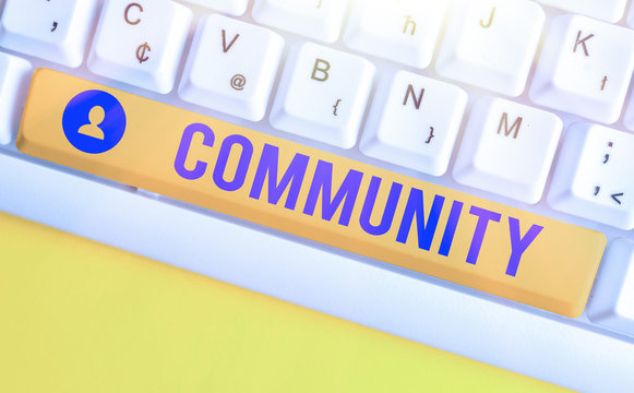 Conceptual hand writing showing Community. Concept meaning group of showing with a common characteristics living together